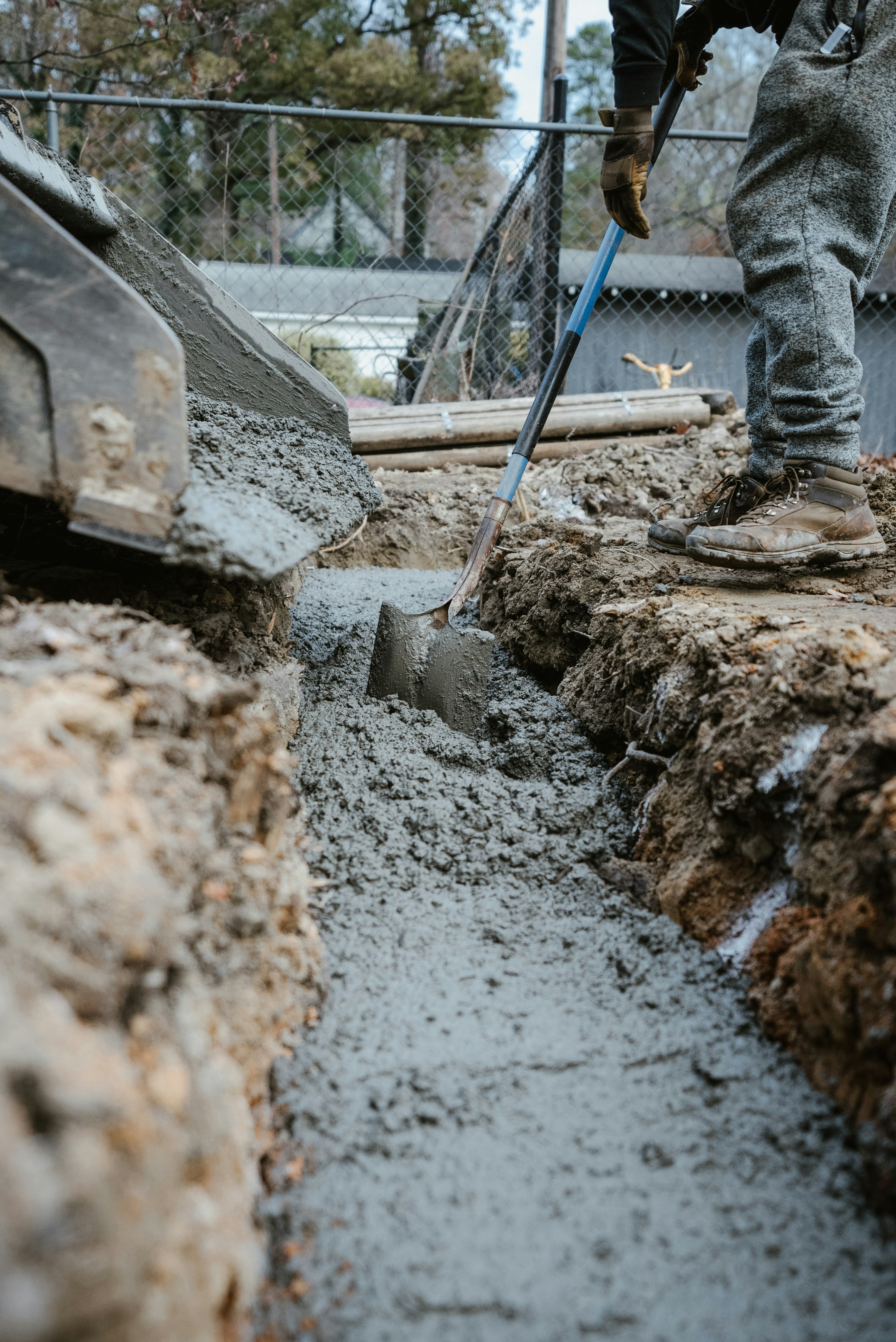 Mason laying block on a job site